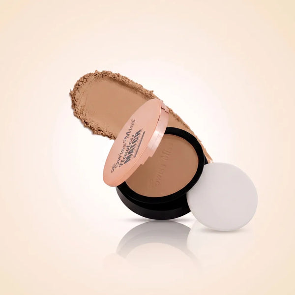 Swiss Miss Flawless Match compact powder in shade SM 04 Almond with rose gold lid, application sponge, and almond face powder swatch.