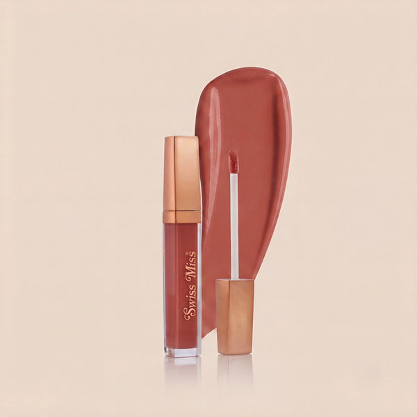 Swiss Miss High Shine Lip Gloss in shade 103 Caramel Kiss featuring rose gold cap, applicator wand, and warm caramel brown lip gloss swatch.