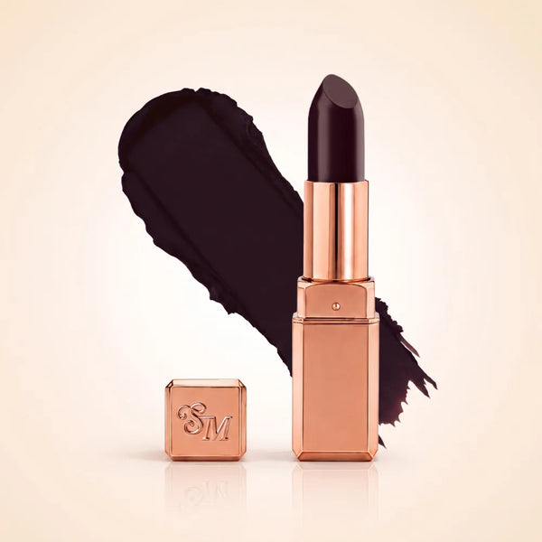 Swiss Miss Silk Matte Lipstick in shade Deep Cherry 710 featuring sleek rose gold metallic square tube casing with a rich ultra-dark cherry plum red lipstick swatch.