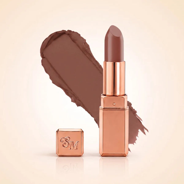 Swiss Miss Silk Matte Lipstick in shade Rich Roast 731 featuring sleek rose gold metallic square tube casing with a warm medium chestnut brown nude lipstick swatch.