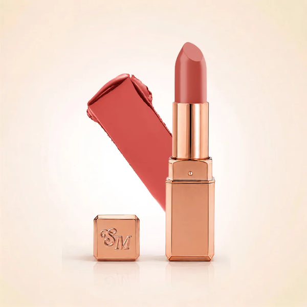 Swiss Miss Silk Lipstick in shade Dusky Rose (701) in gold bullet packaging shown next to a textured color swatch.