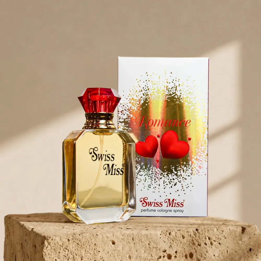 Swiss Miss Romance Perfume 15ml bottle and packaging box with red heart design on a stone pedestal.