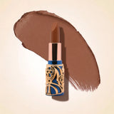 Swiss Miss Bling Lipstick in shade Cashmere Brown B-112 featuring ornate blue and gold filigree bullet tube casing with a rich warm chocolate brown lipstick swatch.