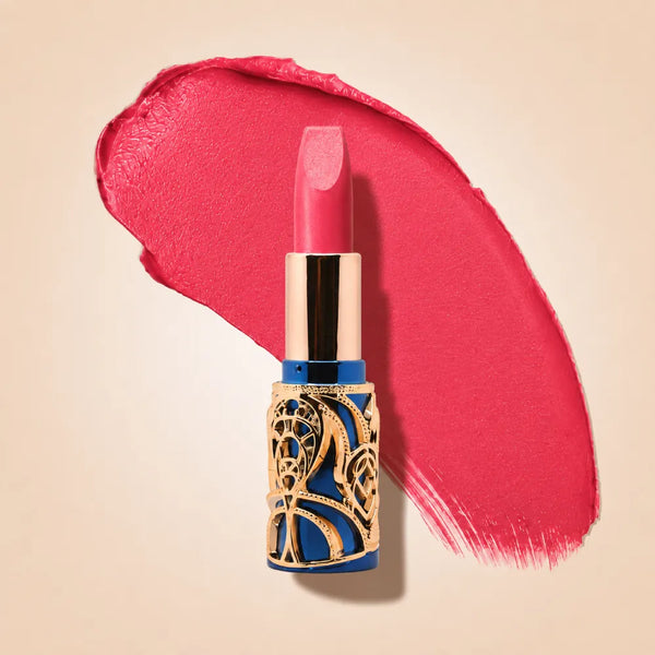 Swiss Miss Bling Lipstick in shade Hot Pink B-109 featuring ornate blue and gold filigree bullet tube casing with a bold bright hot pink lipstick swatch.