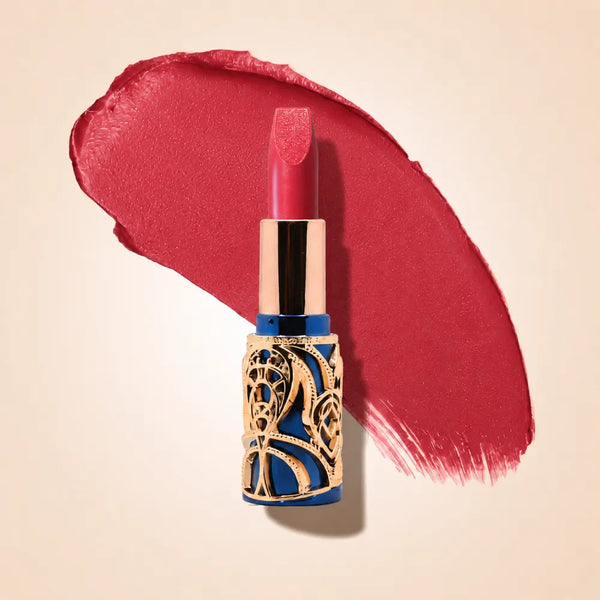 Swiss Miss Bling Lipstick in shade Soar Pink B-108 featuring ornate blue and gold filigree bullet tube casing with a bright vibrant rose pink lipstick swatch.