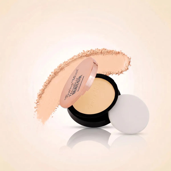 Swiss Miss Flawless Match compact powder in shade SM 02 Fine Ivory with rose gold lid, application sponge, and fine ivory face powder swatch.