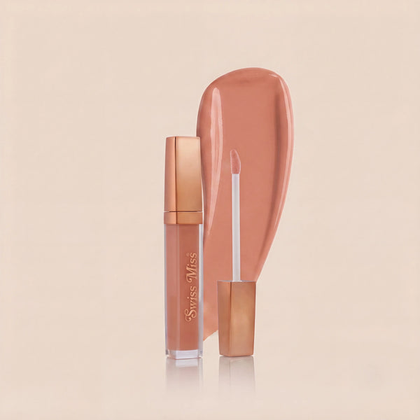 Swiss Miss High Shine Lip Gloss in shade 102 Peach Glow featuring rose gold cap, applicator wand, and soft peachy nude lip gloss swatch.