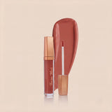 Swiss Miss High Shine Lip Gloss in shade 103 Caramel Kiss featuring rose gold cap, applicator wand, and warm caramel brown lip gloss swatch.