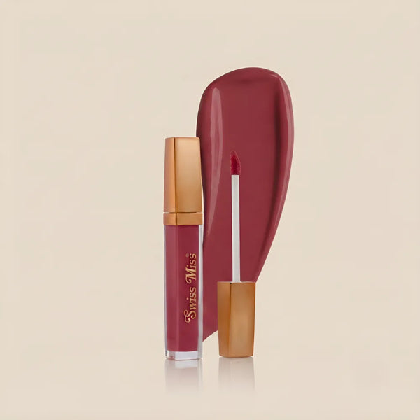 Swiss Miss High Shine Lip Gloss in shade 106 Blush Hour featuring rose gold cap, applicator wand, and deep berry pink lip gloss swatch.