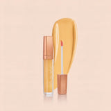 Swiss Miss High Shine Lip Gloss in shade 60 Magic Glow featuring rose gold cap, applicator wand, and warm yellow lip gloss swatch.