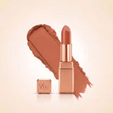 Swiss Miss Silk Matte Lipstick in shade Glitter Bomb 729 featuring sleek rose gold metallic square tube casing with a warm peach nude terracotta lipstick swatch.
