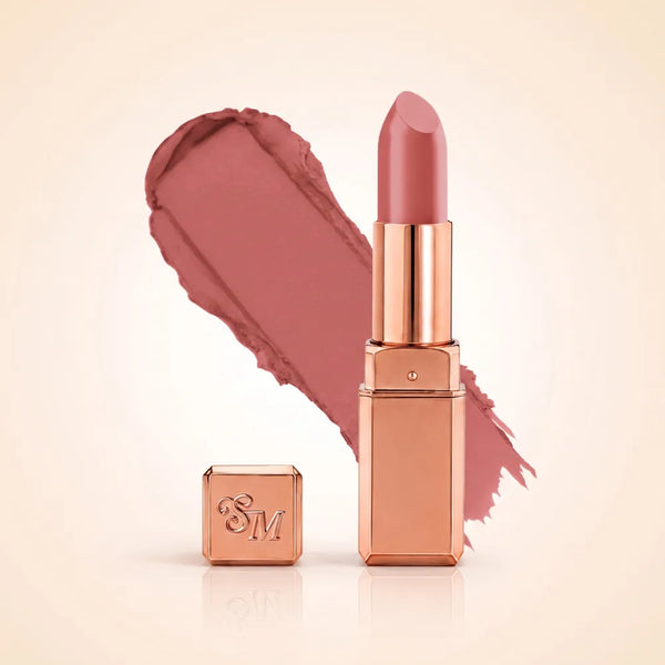 Swiss Miss Silk Matte Lipstick in shade Base Pink 713 featuring sleek rose gold metallic square tube casing with a soft mid-tone dusty pink lipstick swatch.