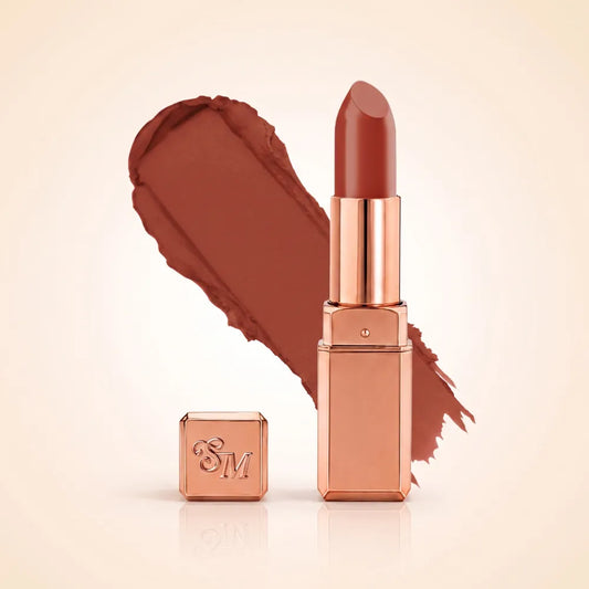 Swiss Miss Silk Matte Lipstick in shade Birkin Brown 707 featuring sleek rose gold metallic square tube casing with a deep reddish cocoa brown lipstick swatch.