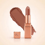 Swiss Miss Silk Matte Lipstick in shade Caramel Nude 703 featuring sleek rose gold metallic square tube casing with a warm beige caramel brown nude lipstick swatch.