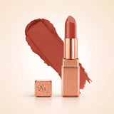Swiss Miss Silk Matte Lipstick in shade Clay Crush 704 featuring sleek rose gold metallic square tube casing with a warm terracotta clay peach-brown lipstick swatch.
