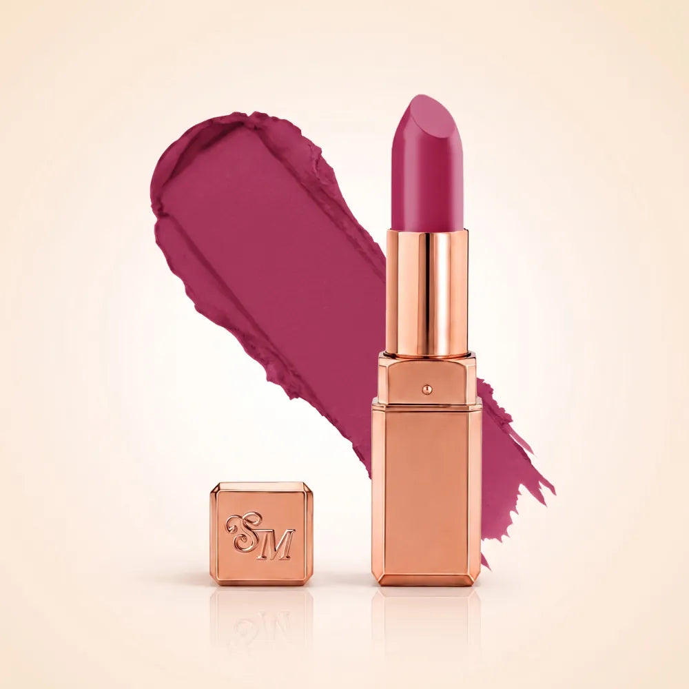 Swiss Miss Silk Matte Lipstick in shade Fuchsia 719 featuring sleek rose gold metallic square tube casing with a bright deep fuchsia magenta pink lipstick swatch.