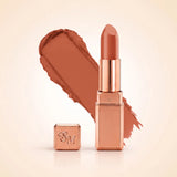 Swiss Miss Silk Matte Lipstick in shade Glitter Bomb 729 featuring sleek rose gold metallic square tube casing with a warm peach nude terracotta lipstick swatch.