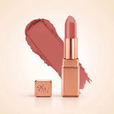 Swiss Miss Silk Matte Lipstick in shade Honey Pink 702 featuring sleek rose gold metallic square tube casing with a warm peach nude pink lipstick swatch.