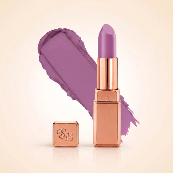 Swiss Miss Silk Matte Lipstick in shade Lilac Mauve 723 featuring sleek rose gold metallic square tube casing with a cool dusty lavender lilac mauve lipstick swatch.