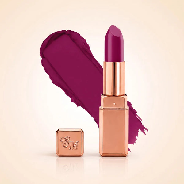 Swiss Miss Silk Matte Lipstick in shade Mulberry 721 featuring sleek rose gold metallic square tube casing with a rich deep mulberry wine berry lipstick swatch.