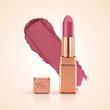 Swiss Miss Silk Matte Lipstick in shade Orchid Dream 724 featuring sleek rose gold metallic square tube casing with a bright orchid mauve berry pink lipstick swatch.