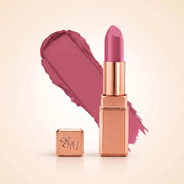 Swiss Miss Silk Matte Lipstick in shade Orchid Dream 724 featuring sleek rose gold metallic square tube casing with a bright orchid mauve berry pink lipstick swatch.
