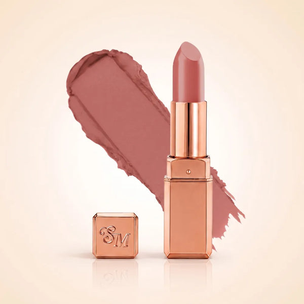 Swiss Miss Silk Matte Lipstick in shade Rose Taupe 706 featuring sleek rose gold metallic square tube casing with a soft dusty rose taupe brown lipstick swatch.