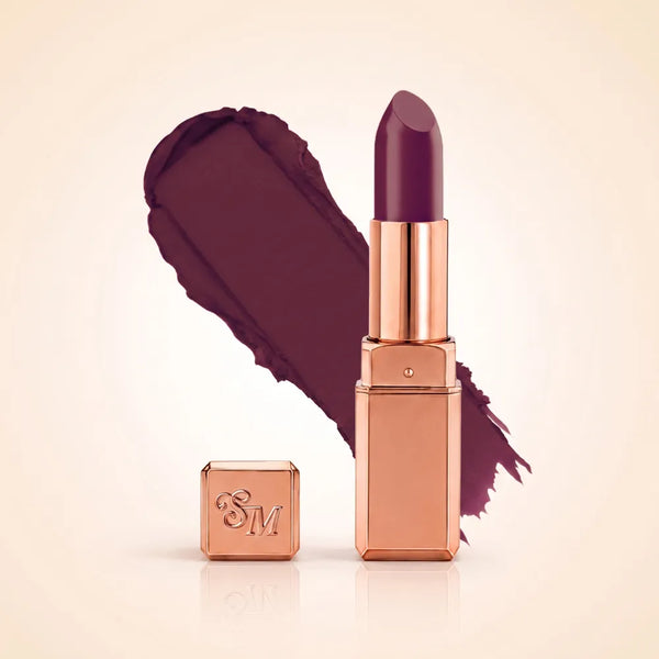 Swiss Miss Silk Matte Lipstick in shade Viva Heart 725 featuring sleek rose gold metallic square tube casing with a deep plum burgundy wine lipstick swatch.