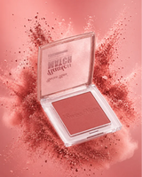 Swiss Miss Flawless Match single powder blush compact in shade Natural Peach SM 001 surrounded by a peach-pink powder burst.