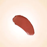 Rich terracotta bronze-brown texture swatch of Swiss Miss Bronze Affair B-113 lipstick on a neutral background.