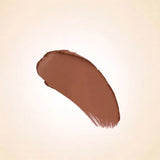 Warm medium nude brown texture swatch of Swiss Miss Cashmere Brown B-112 lipstick on a neutral background.