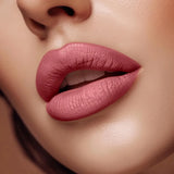 Close-up of lips wearing Swiss Miss Cashmere Cocoa B-105 matte lipstick shade.