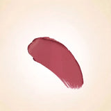 Soft rosy mauve-cocoa texture swatch of Swiss Miss Cashmere Cocoa B-105 lipstick on a neutral background.