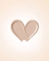 Heart-shaped liquid texture swatch of Swiss Miss Matte and Poreless CC Concealer in shade Fine Plush SM 03