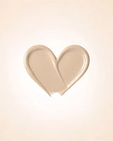 Heart-shaped liquid texture swatch of Swiss Miss Matte and Poreless CC Concealer in shade Flawless Natural SM 02