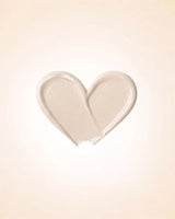 Heart-shaped liquid texture swatch of Swiss Miss Matte and Poreless CC Concealer in shade Pearl Ivory SM 01