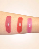 Forearm color swatches comparing Swiss Miss Classic Lipstick shades 523, 524, and 525.