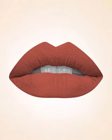 Close-up swatch of Swiss Miss Classic Lipstick in Copper Gold M-115 applied on lips.