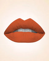Close-up lip swatch of Swiss Miss Classic Lipstick in Coral Gold M-79 shade.