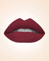 Close-up lip swatch of Swiss Miss Classic Lipstick in Deep Maroon M-226 shade.