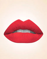 Lip swatch application of Swiss Miss Classic Lipstick in shade Pink M-39 showing a rich coral pink lip finish.