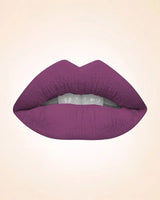Close-up lip swatch of Swiss Miss Classic Lipstick in Violet Vibe M-516 shade.
