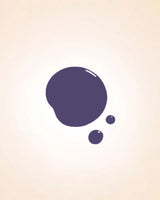 Glossy dark grape purple liquid nail polish drop swatch showing shade texture and finish.