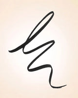 Smooth continuous black stroke swatch demonstrating the pigment payout and fine precision of Swiss Miss Marker Eyeliner.