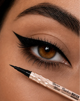 Close-up of classic sharp black winged eyeliner application with the Swiss Miss Flawless Match Marker Eyeliner precision felt tip.