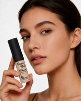 Model holding Swiss Miss Matte and Poreless CC Concealer in shade Peachy Pink SM 04