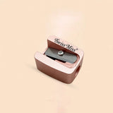 Swiss Miss rose gold metallic cosmetic pencil sharpener with single blade for lip and eye pencils.