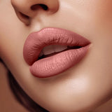 Close-up of lips wearing Swiss Miss Mocha Mousse B-102 matte lipstick shade.