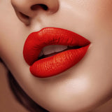 Close-up of lips wearing Swiss Miss Red Diva B-116 matte lipstick shade.