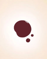 Glossy dark cherry red liquid nail polish drop swatch in shade Ribbon Red 224 showing finish and texture.